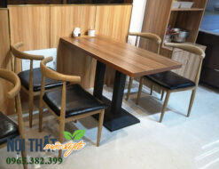 Bàn ghế Bull tông màu nâu óc chó và nệm da màu đen sang trọng