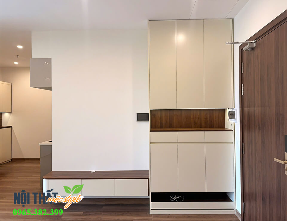 Tủ giày liền kệ tivi được bố trí ngăn kéo dễ dàng thay giày dép đi trong nhà mà không phải cúi Tủ giày liền kệ tivi được bố trí ngăn kéo dễ dàng thay giày dép đi trong nhà mà không phải cúi